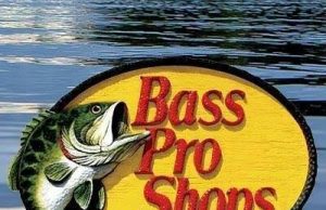 Bass Pro Shops Review: Your One-Stop Outdoor Gear Destination Angler using Bass Pro Shops fishing gear on a lake at sunrise